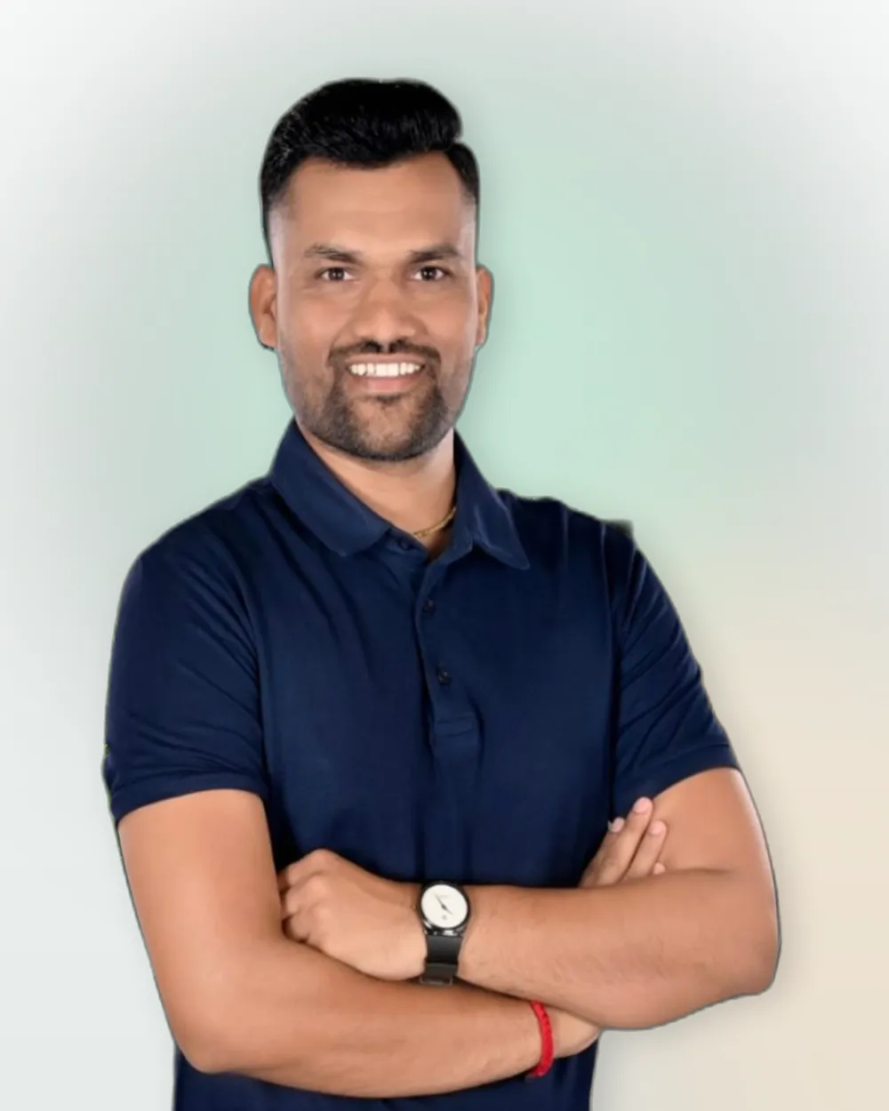 Vijay Barot, founder of AviraOps, smiling with arms crossed