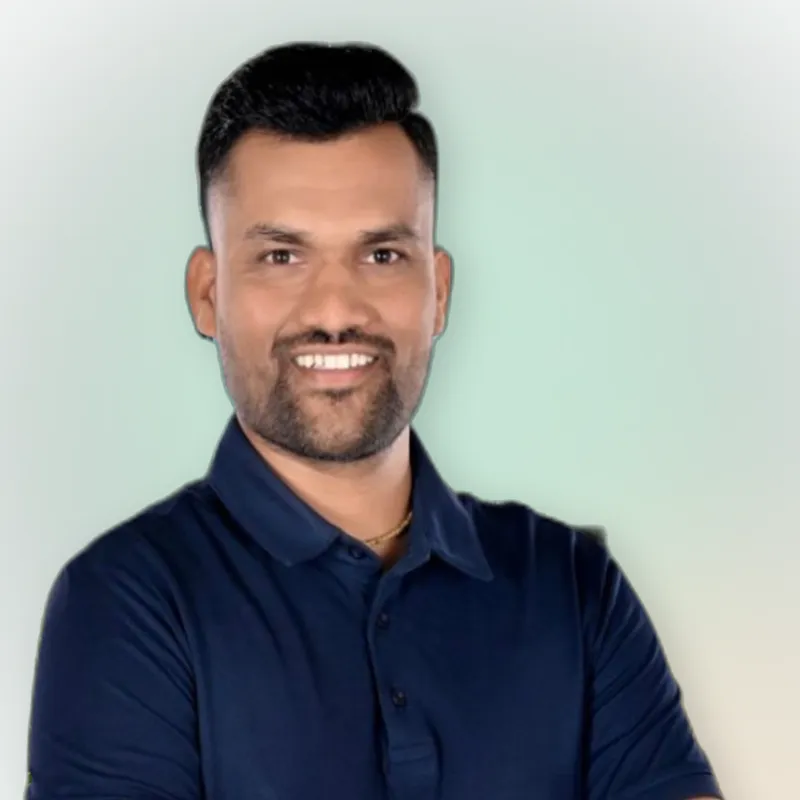 Vijay Barot, founder of AviraOps, smiling with arms crossed